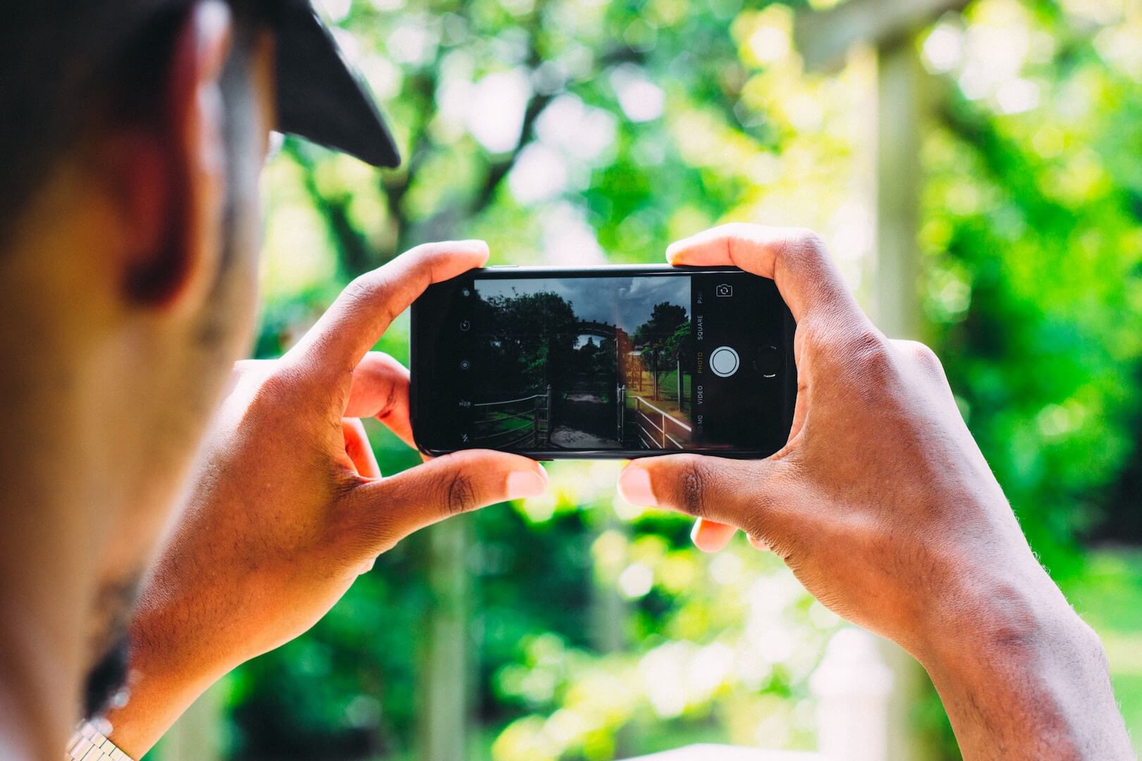 Person taking photo with an iPhone